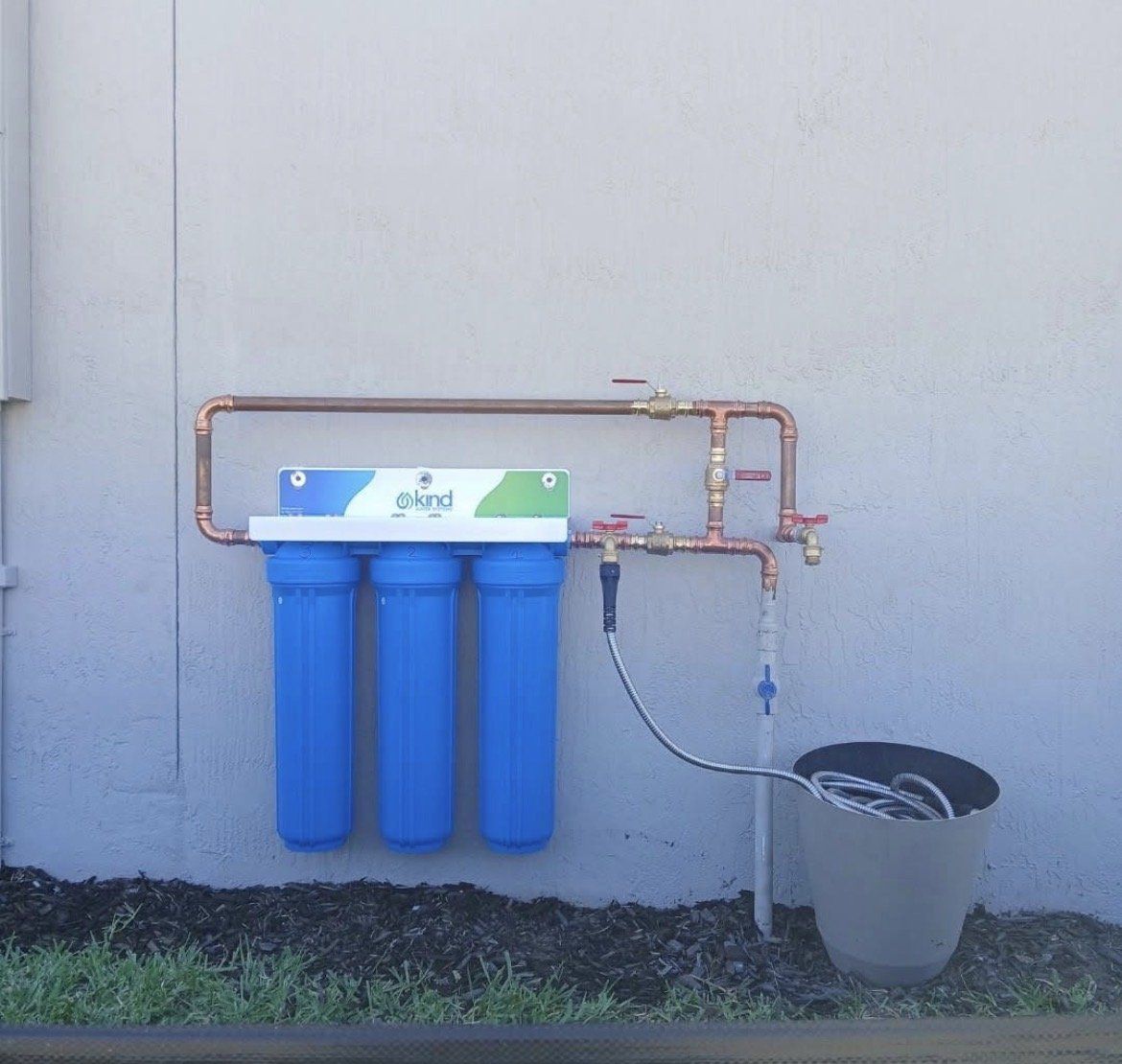 Kind Water Systems whole-house water filtration system with copper piping